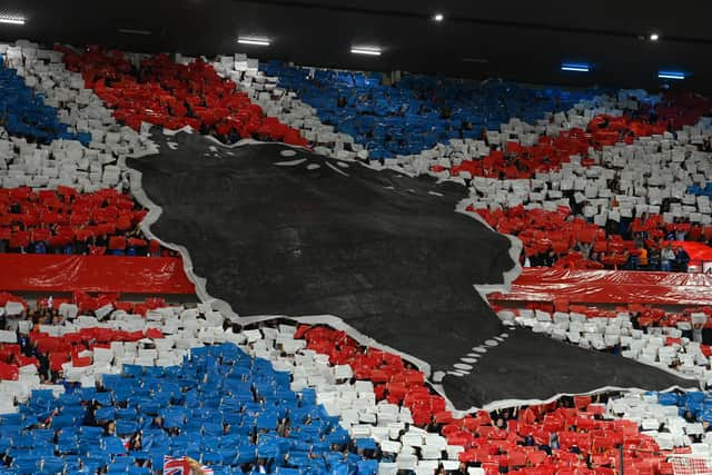 Rangers fans make a mural of the Union Jack to pay tribute to Her Majesty Queen Elizabeth II, who died away at Balmoral Castle on September 8 prior to the UEFA Champions League group A match between Rangers FC and SSC Napoli at Ibrox Stadium on September 14, 2022 in Glasgow, Scotland. Picture: Stu Forster/Getty Images.