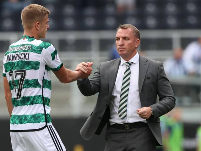 Celtic manager Brendan Rodgers and Maik Nawrocki