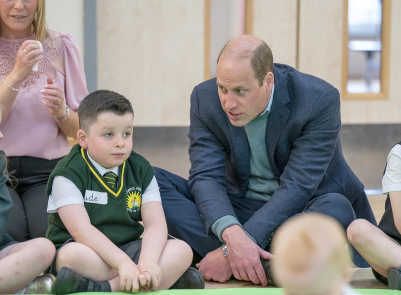 Prince William meets pupils during a visit to St. John's Primary School.