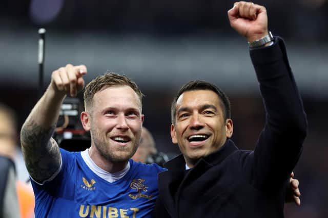 GLASGOW, SCOTLAND - MAY 05: Scott Arfield of Rangers and Giovanni van Bronckhorst, Manager of Rangers celebrate after victory in the UEFA Europa League Semi Final Leg Two match between Rangers and RB Leipzig at Ibrox Stadium on May 05, 2022 in Glasgow, Scotland. (Photo by Ian MacNicol/Getty Images)