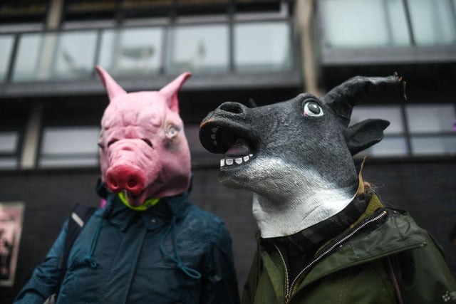 Extinction Rebellion protesters are seen outside the entrance to the COP26 site