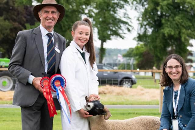 Joanna Dale won the overall young handlers title, pictured here with Jimmy and Carol-Anne Warnock.