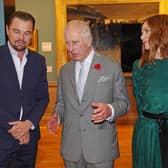 Prince of Wales speaks with Leonardo DiCaprio as he views a fashion installation by designer Stella McCartney.