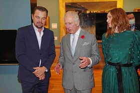 Prince of Wales speaks with Leonardo DiCaprio as he views a fashion installation by designer Stella McCartney.