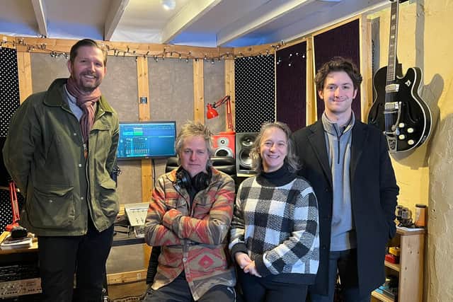 Members of Leadhills Family Action Group celebrate their successes with Banks Renewables team, who popped into the ‘studio’ for a visit.