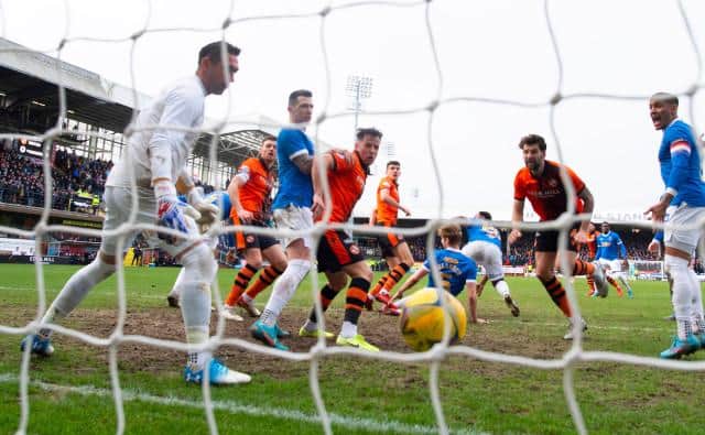 Dundee United's Ross Graham scores to make it 1-0 during a Cinch Premiership match between Dundee United and Rangers at Tannadice Park, on February 20, 2022, in Dundee, Scotland. (Photo by Alan Harvey / SNS Group)