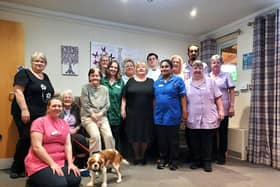 Staff, residents and Bo the dog at Milton Grange