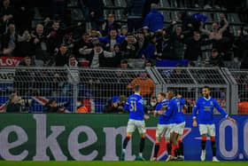 Rangers' English midfielder John Lundstram celebrates in front of the delirious travelling fans.