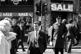 Pedestrians - and a traffic warden - cross against the lights in Argyle Street Glasgow - August 1974.