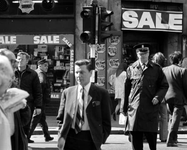 Pedestrians - and a traffic warden - cross against the lights in Argyle Street Glasgow - August 1974.