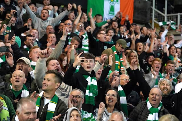 Celtic fans celebrate after the cinch Premiership match at Tannadice Park, Dundee. Picture date: Wednesday May 11, 2022.