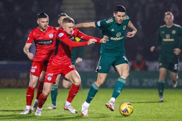 PAISLEY, SCOTLAND - DECEMBER 22: Dylan Reid and Tom Rogic in action during a Cinch Premiership match between St. Mirren and Celtic at SMiSA Stadium, on December 22, 2021, in Paisley, Scotland.  (Photo by Craig Williamson / SNS Group)