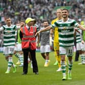 Liel Abada leads the Celtic celebrations at full time after a huge win for the club against Rangers.
