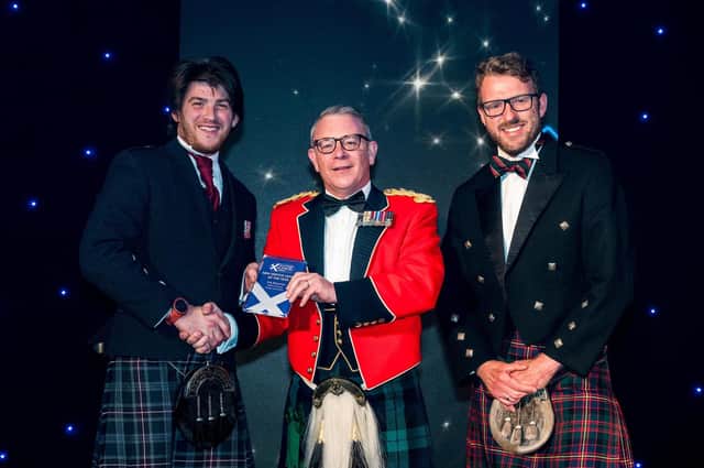 Kris McLernon is presented with his award by Lt Col Lorne Campbell and JJ Chalmers. Pic: Ian Arthur