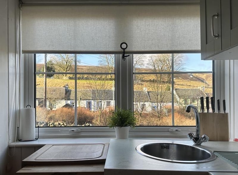 One of the kitchen's best features is the stunning view over the village and hills beyond which is almost enough to make you want to put the rubber gloves on – almost!