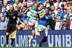 Rangers' James Tavernier and Celtic's Daizen Maeda in action during the first Old Firm derby this season.