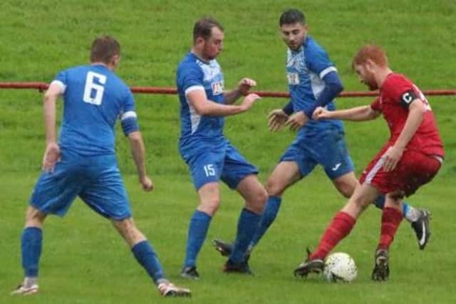 Thorniewood United (in blue strips) won penalty shootout (Library pic)