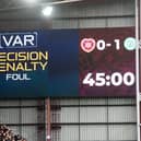 After VAR intervention, referee Nick Walsh awards a penalty for a foul in the box by Celtic's Cameron Carter-Vickers on Hearts' Cammy Devlin. (Photo by Mark Scates / SNS Group)