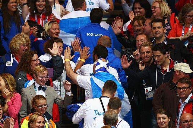 Athletes from Scotland walk up through the crowd during the Closing Ceremony for the Glasgow 2014 Commonwealth Games at Hampden Park.