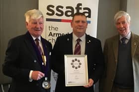 Andy McIntosh (centre) receives the Sir James Gildea Award.