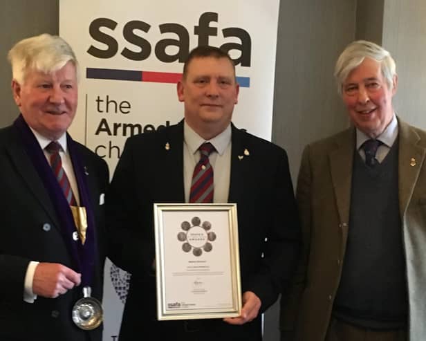 Andy McIntosh (centre) receives the Sir James Gildea Award.