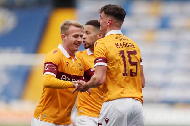 Jake Carroll (centre) and Robbie Crawford celebrate with goalscorer Barry Maguire at Kilmarnock (Pic by Ian McFadyen)