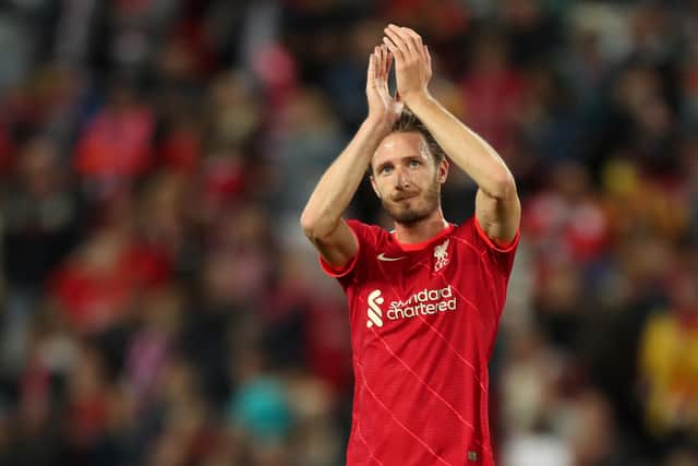 Ben Davies Liverpool applauds the Liverpool fans after appearing in a pre-season match against Osasuna at Anfield last August. (Photo by Lewis Storey/Getty Images)