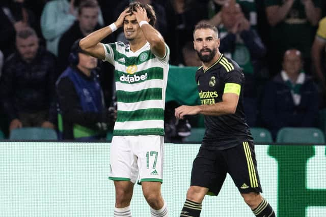 Celtic's Jota despairs over an early missed chance over Real Madrid as Karim Benzema looks on. Now the winger is pledging that Ange Postecoglou's men will learn from mistakes in the 3-0 loss. (Photo by Alan Harvey / SNS Group)