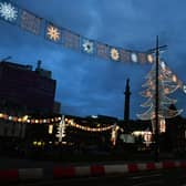 See Christmas lights brighten up George Square for the festive season. Photo: John Devlin.