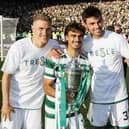 Celtic's Carl Starfelt (L) Jota and Matt O'Riley (R) with the Scottish Cup last season.