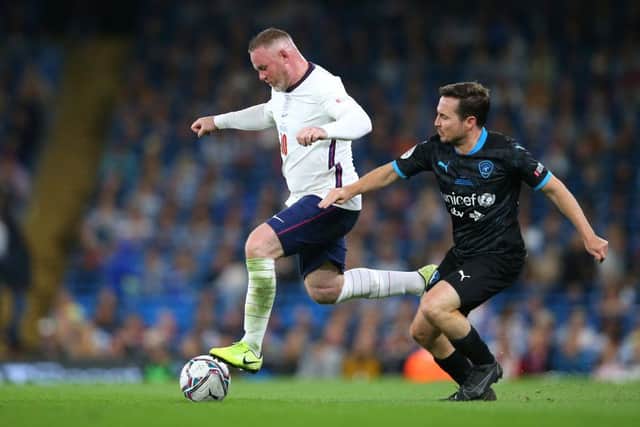 Wayne Rooney of England beats Martin Compston of Soccer Aid World XI during Soccer Aid for Unicef 2021 match between England and Soccer Aid World XI at Etihad Stadium on September 04, 2021 in Manchester, England. (Photo by Alex Livesey/Getty Images)