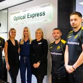 Caledonian Locomotives defender Mark McHendry, goalkeeper Kiel Johnathan Clarke-Davis, coach John McGowan and manager Kevin Kelly unveil the new home shirt with Molly Whyte, Claire Milne and Erin Lang of Optical Express (pic: lutherpendragon)