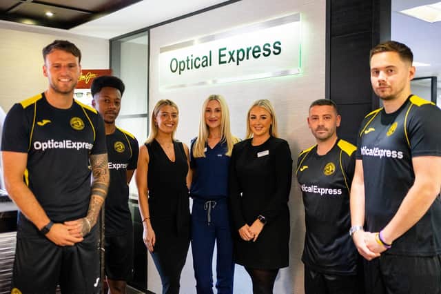 Caledonian Locomotives defender Mark McHendry, goalkeeper Kiel Johnathan Clarke-Davis, coach John McGowan and manager Kevin Kelly unveil the new home shirt with Molly Whyte, Claire Milne and Erin Lang of Optical Express (pic: lutherpendragon)