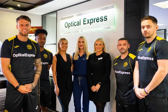 Caledonian Locomotives defender Mark McHendry, goalkeeper Kiel Johnathan Clarke-Davis, coach John McGowan and manager Kevin Kelly unveil the new home shirt with Molly Whyte, Claire Milne and Erin Lang of Optical Express (pic: lutherpendragon)