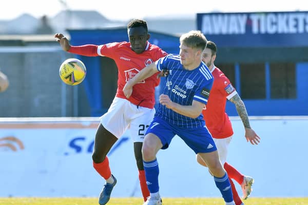 Two-goal Peterhead hero Hamish Ritchie with Clyde's Ewan Otoo (pic: Duncan Brown)