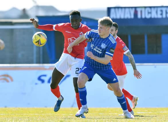 Two-goal Peterhead hero Hamish Ritchie with Clyde's Ewan Otoo (pic: Duncan Brown)