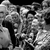 Queen Elizabeth II meets some of the residents at the new multi-storey flats in the Gorbals, Glasgow, in July 1972.