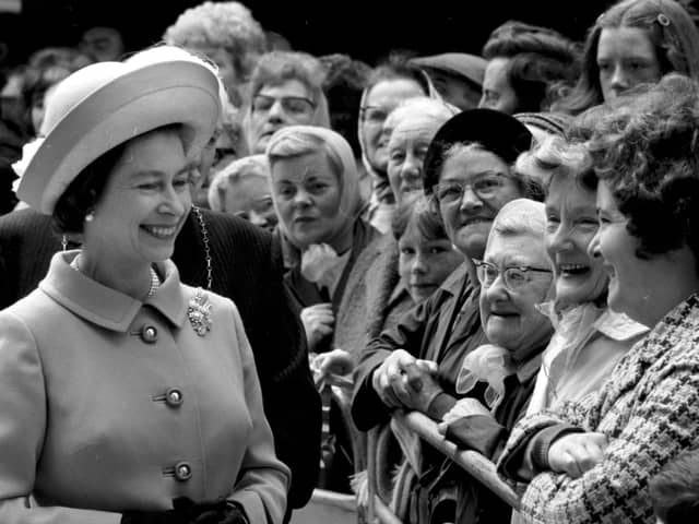 Queen Elizabeth II meets some of the residents at the new multi-storey flats in the Gorbals, Glasgow, in July 1972.