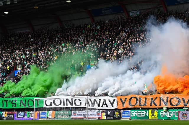 The Celtic support housed in the Roseburn Stand unfurled this banner on pyro ahead of the match against Hearts, followed by a number of flares.