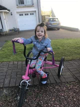 Little Ella Faulds on her special needs trike