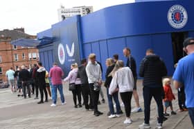 Rangers fans queue up outside the club shop at Ibrox after the release of the home strip last month. Picture: SNS