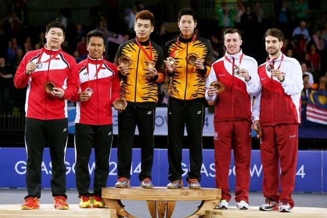 (L-R) Silver medalists Chayut Triyachart and Danny Chrisnanta of Singapore, gold medalists Wee Kiong Tan and Mas Wei Shem of Malaysia and bronze medallists Peter Mills and Chris Langridge of England pose in the medal ceremony for the Men's Doubles Gold Medal Match at Emirates Arena during day eleven of the Glasgow 2014 Commonwealth Games on August 3, 2014.