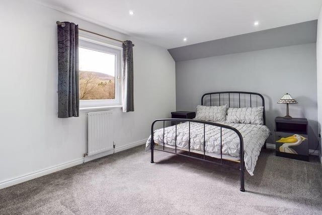 A double bedroom on the upper floor, enjoying beautiful views to the surrounding countryside.