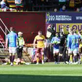 Referee Nick Walsh flashes red card for Balogun (out of picture)