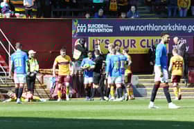 Referee Nick Walsh flashes red card for Balogun (out of picture)