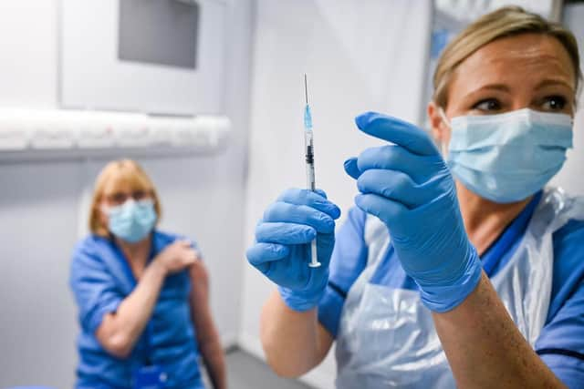 A patient receives the coronavirus vaccine at the Louisa Jordan Hospital in Glasgow. Photo: Jeff J Mitchell - Pool /Getty Images.