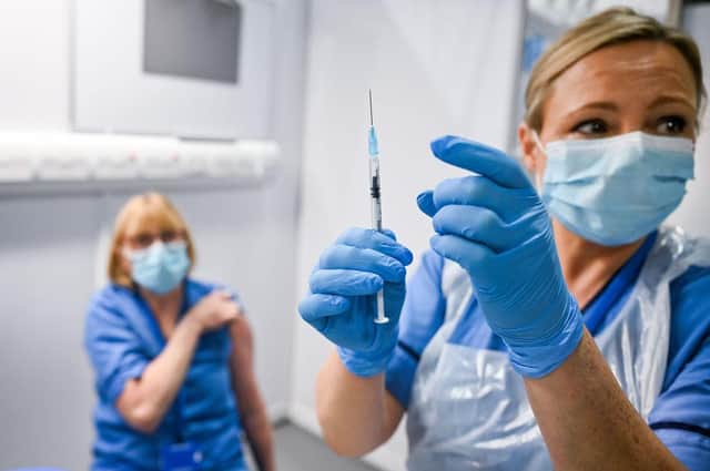 A patient receives the coronavirus vaccine at the Louisa Jordan Hospital in Glasgow. Photo: Jeff J Mitchell - Pool /Getty Images.