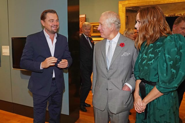 Prince Charles with British designer Stella McCartney and Leonardo DiCaprio.