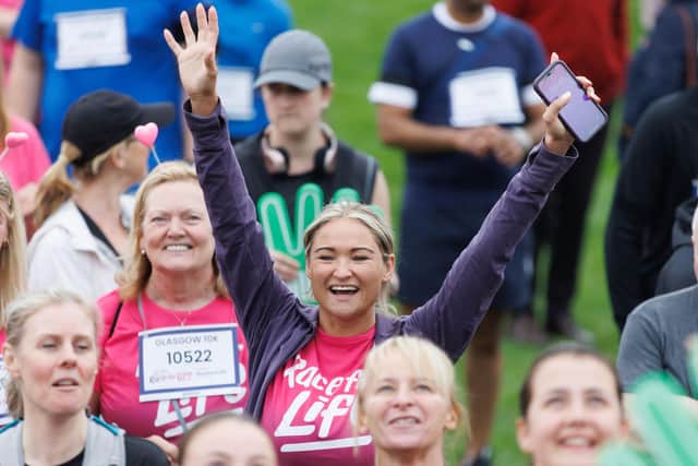 Feeling on top of the world at the Glasgow Race for Life. PIC: Steve Welsh.