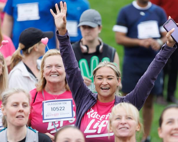 Feeling on top of the world at the Glasgow Race for Life. PIC: Steve Welsh.